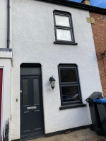 Anthracite grey on white Liniar windows with matching composite door